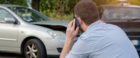 A person injured in an accident calling a lawyer for help.