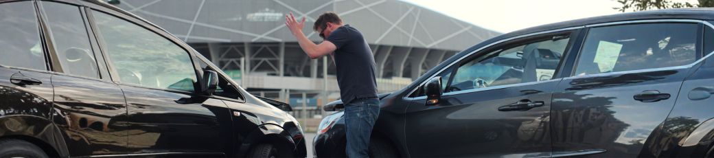 Driver reacting after a car accident involving two vehicles in Texas, representing an uninsured driver crash in the Rio Grande Valley