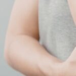 Person holding their arm in pain next to a note labeled personal injury, representing an injury claim in Texas
