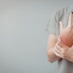 Person holding their wrist in pain representing injury and physical suffering after an accident in Texas