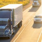 18-wheeler truck driving on a Texas highway alongside passenger vehicles