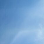 Thermometer showing high temperatures under a bright summer sun representing the risk of heat-related workplace injuries in McAllen and the Rio Grande Valley.