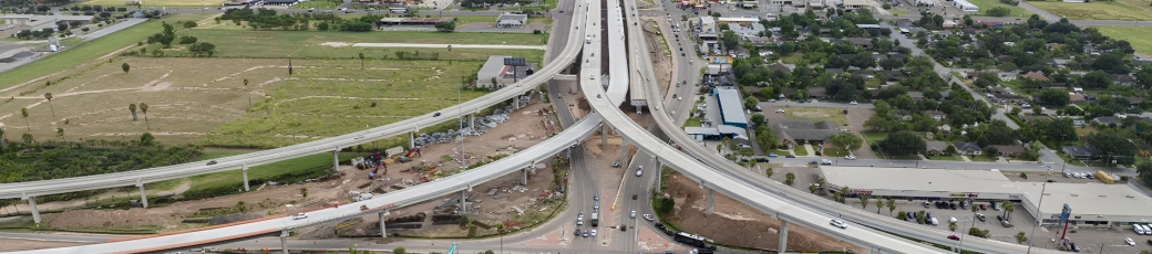 Aerial view of a major highway interchange and busy roadways in McAllen, Texas, illustrating traffic congestion and potential accident risks in the Rio Grande Valley.