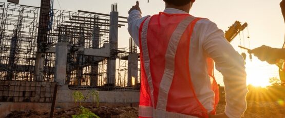 Construction workers wearing safety vests at a Texas construction site