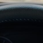 Driver holding steering wheel after a hit-and-run accident in Texas