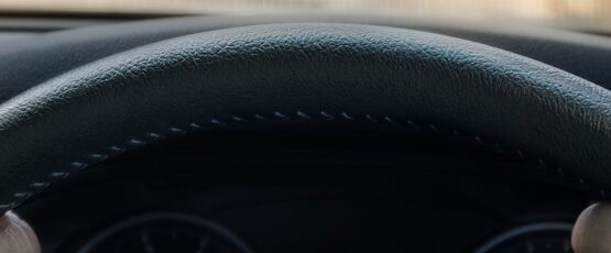 Driver holding steering wheel after a hit-and-run accident in Texas